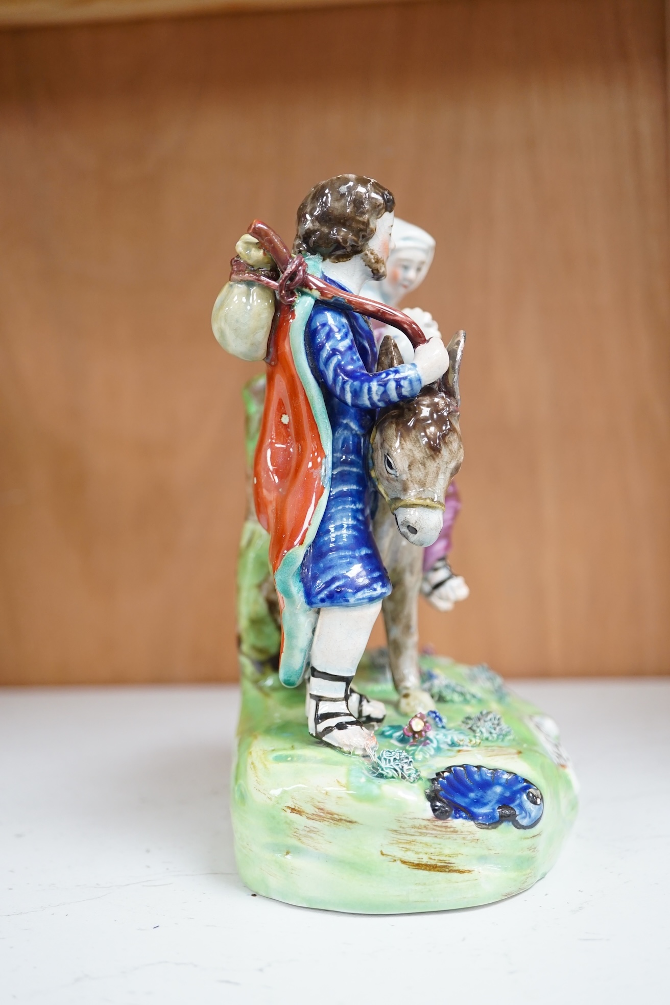 An early 19th century pearlware ‘flight to Egypt’ group, by Walton, 16.5 cm high. Condition - some restoration and bocage lacking